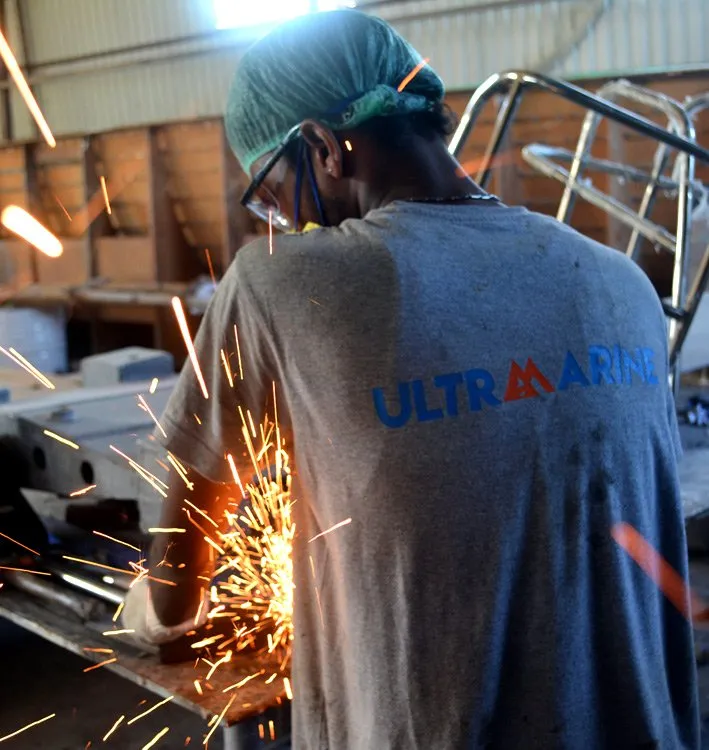 Ultramarine craftsperson working in the boatyard
